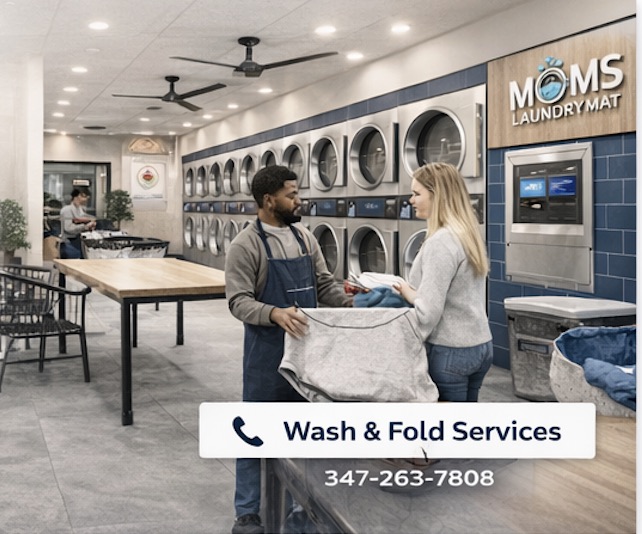 Customer handing a full laundry bag to a Mom's LaundryMat team member for pickup and delivery in Brooklyn